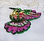 Broche colibri brodée de sequins et perles colorées.