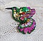 Broche colibri brodée de sequins et perles colorées.