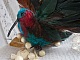 Le Colibri Thalassin cr&eacute;e enti&egrave;rement en porcelaine, des plumes de Coq et Fantaisies, des petites rocailles