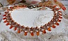 Collier Ambre avec des cristaux de Swarovski : perles nacr&eacute;es/toupies, gouttes en verre et rocailles. Aux couleurs Topaze, Travertin, Copper et Gold pour une transparence aux reflets ambr&eacute;s.
