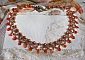 Collier Ambre avec des cristaux de Swarovski : perles nacr&eacute;es/toupies, gouttes en verre et rocailles. Aux couleurs Topaze, Travertin, Copper et Gold pour une transparence aux reflets ambr&eacute;s.