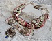 Plastron Arc-En-Ciel Haute-Couture brod&eacute; avec un cabochon en porcelaine de Limoge, des cristaux de Swarovski et des nacres. 