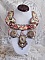 Plastron Arc-En-Ciel Haute-Couture brod&eacute; avec un cabochon en porcelaine de Limoge, des cristaux de Swarovski et des nacres. 