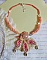 Collier brodé en soie, corail rose et perles artisanales.