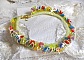 Collier Garden Flowers mont&eacute; avec des fleurs et feuilles Lucites aux couleurs vari&eacute;es, perl&eacute; de rocailles Jaunes, Ivoires et Nacr&eacute;es &agrave; laquelle s'ajoute des tubes, cristaux et un fermoir en Argent 925