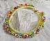 Collier Garden Flowers mont&eacute; avec des fleurs et feuilles Lucites aux couleurs vari&eacute;es, perl&eacute; de rocailles Jaunes, Ivoires et Nacr&eacute;es &agrave; laquelle s'ajoute des tubes, cristaux et un fermoir en Argent 925