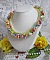 Collier Garden Flowers mont&eacute; avec des fleurs et feuilles Lucites aux couleurs vari&eacute;es, perl&eacute; de rocailles Jaunes, Ivoires et Nacr&eacute;es &agrave; laquelle s'ajoute des tubes, cristaux et un fermoir en Argent 925