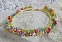Collier Garden Flowers mont&eacute; avec des fleurs et feuilles Lucites aux couleurs vari&eacute;es, perl&eacute; de rocailles Jaunes, Ivoires et Nacr&eacute;es &agrave; laquelle s'ajoute des tubes, cristaux et un fermoir en Argent 925