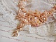 Plastron Idylle Beaut&eacute; Haute Couture brod&eacute; avec cabochons perl&eacute;s de perles rondes nacr&eacute;es en Cristal de Swarovski, des toupies et des rocailles de couleur Saumon, une belle harmonie avec le design 