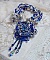 Collier Lotus Flowers avec un cabochon en Verre brod&eacute; sur une base en su&eacute;dine &agrave; laquelle s&rsquo;ajoute :  perles de Venise, coupelles estampes, toupies, chatons, gouttes, rocailles et fermoir Argent 925
