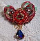 Collier Mia Haute Couture brod&eacute; avec des cabochons en Cristal couleur Rouge et octogone en verre ann&eacute;e 1960, perles en Plaqu&eacute; Or, rubans organza Rouge et Vert, breloques, toupie, goutte et rocailles