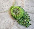 Collier Passion cr&eacute;e avec des chips aventurine, des roses en r&eacute;sine avec un cabochon et des rocailles.