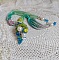Collier artisanal en ruban de soie, fleurs acryliques et perles.