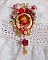 Collier artisanal Roseraie Provençale avec roses et nœud rouge.