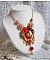 Collier artisanal Roseraie Provençale avec roses et nœud rouge.