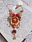 Collier artisanal Roseraie Provençale avec roses et nœud rouge.