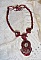 Collier Rubby One brod&eacute;  avec un cabochon en c&eacute;ramique de couleur Gris/Marron &agrave; laquelle s'ajoute des cabochons ronds en Cristal Siam, rocailles Bronze, toupies Light Rose et Rubby avec fermoir en T