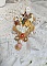Pendentif Aurore mont&eacute; avec un motif &eacute;maill&eacute; aux couleurs du soleil &agrave; laquelle s&rsquo;ajoute perles nacr&eacute;es, breloques, poires avec Zircons, perles, ruban sur une b&eacute;li&egrave;re Argent 925 et une cha&icirc;ne plaqu&eacute; Or