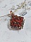 Pendentif Camel mont&eacute; avec des toupies en cristal Indian Red et Smoked Topaz de qualit&eacute; AB sur une base de facettes Dark Bronze et sur un tour de cou c&acirc;bl&eacute; rigide Dor&eacute; avec un fermoir &agrave; vis Argent&eacute;