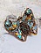 Pendentif papillon brodé de sequins, strass et perles Swarovski.