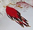 Pendentif Tourbillons de Rouge avec des rocailles aux trois couleurs : Rouge, Bleu Iris et Dor&eacute; pour les pampilles. Le tout est mont&eacute; sur une cha&icirc;ne et un mousqueton en Plaqu&eacute; Or